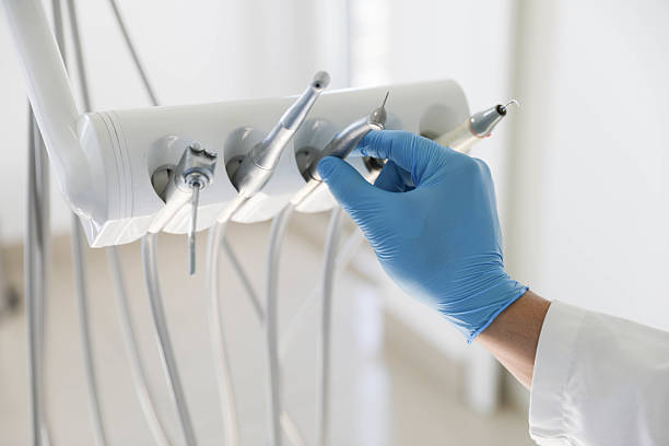 Professional Root Canal Treatment technician working in Oak Grove, LA